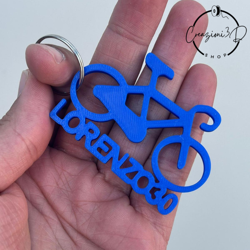 portachiavi blu a forma di bicicletta con nome